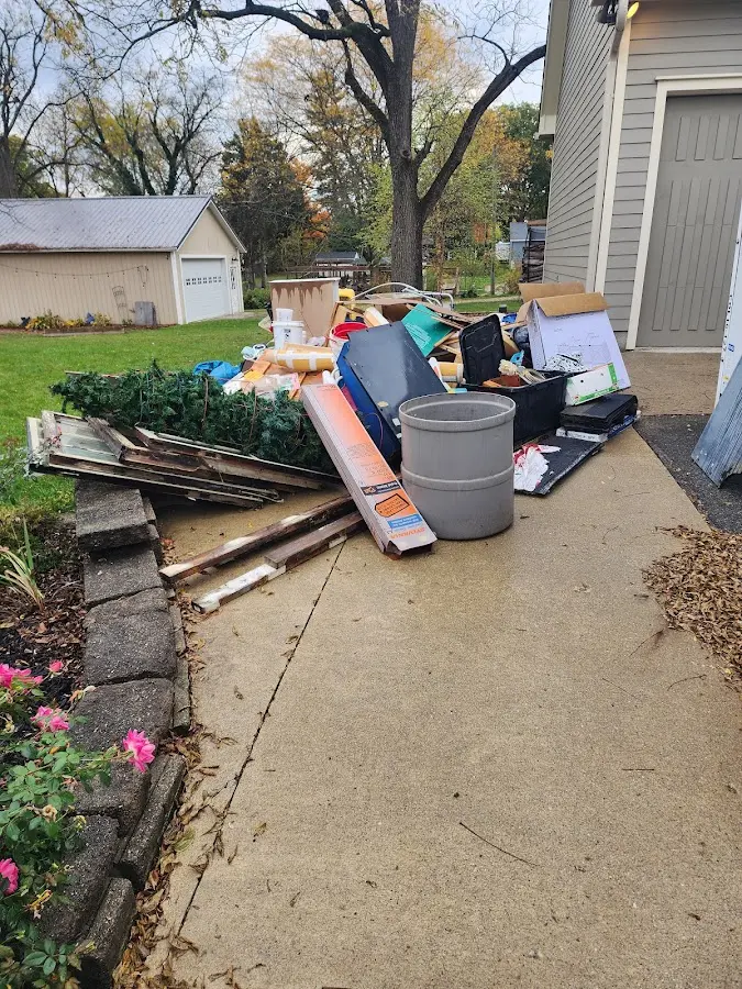 Dumpster being loaded with debris for Demolition Dumpster Rental in Roeland Park